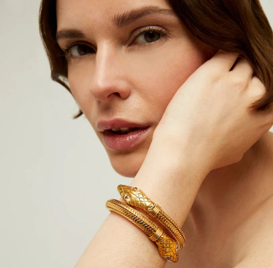 gold cobra bracelet worn on model