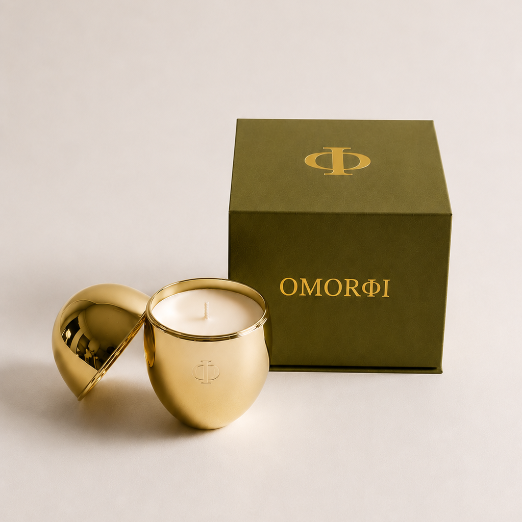 gold omorfi candle with green luxe box