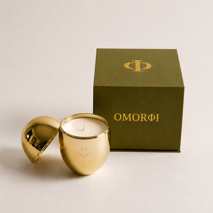 gold omorfi candle with green luxe box