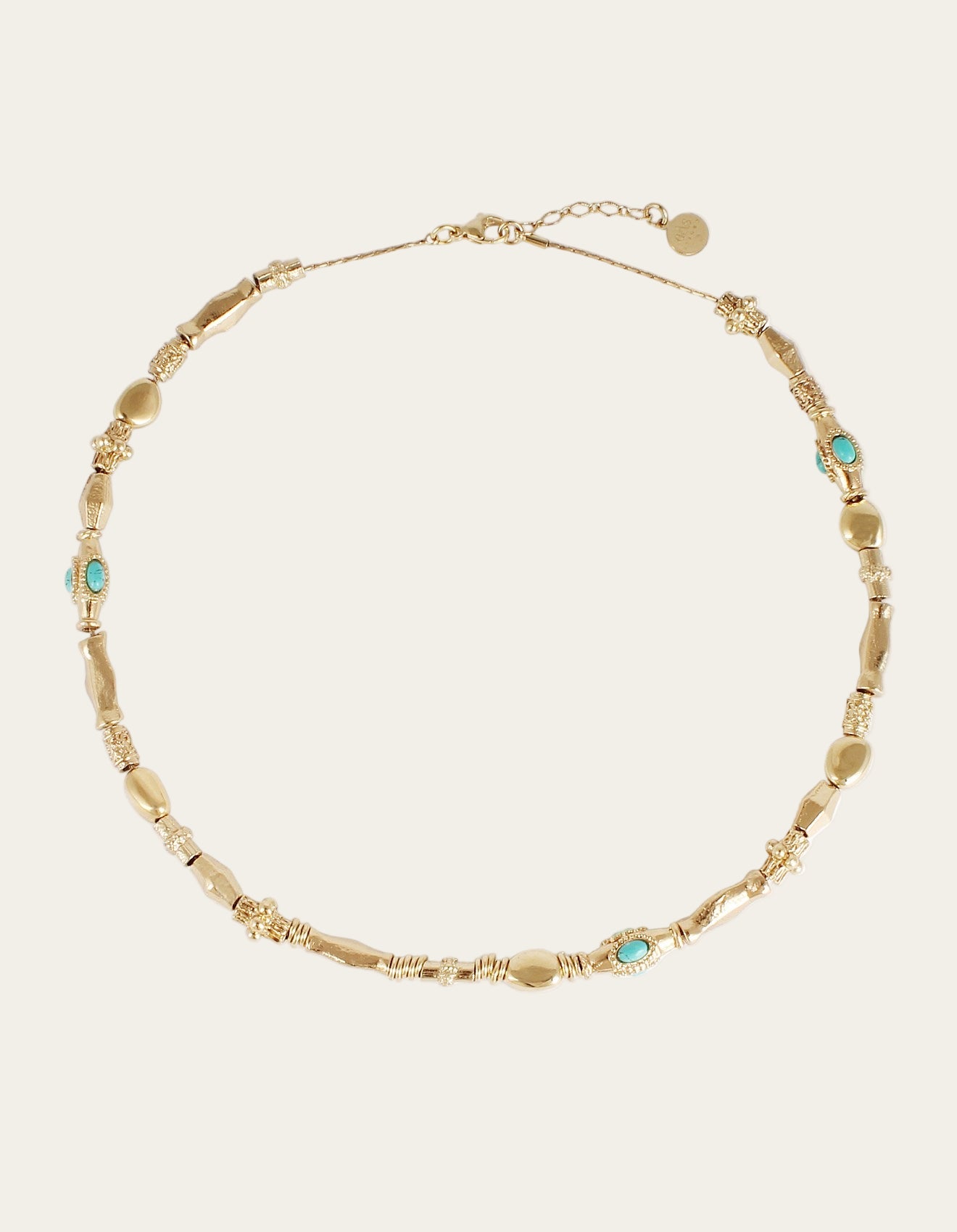 Gold necklace with turquoise stones on a white background