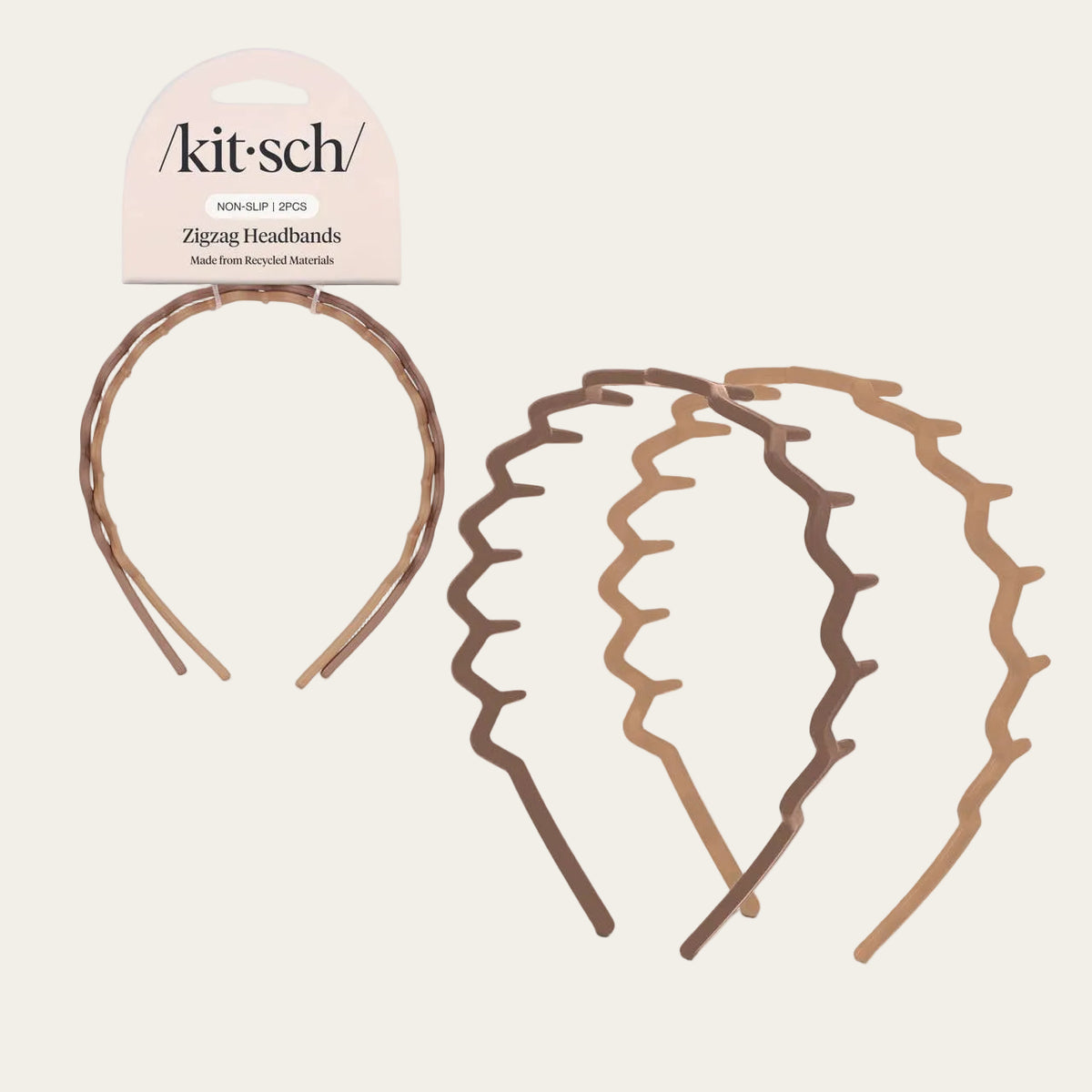 Three wiggle-headband styles in different warm tones with one matching packaged headband on a light gray background. The packaging reads kit:sch and Zigzag Headbands.