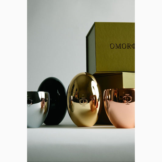 Silver, black, gold and rose gold egg shaped candles and luxury green gift box