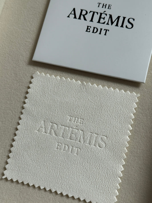 TAE jewellery cloth with white branded sleeve
