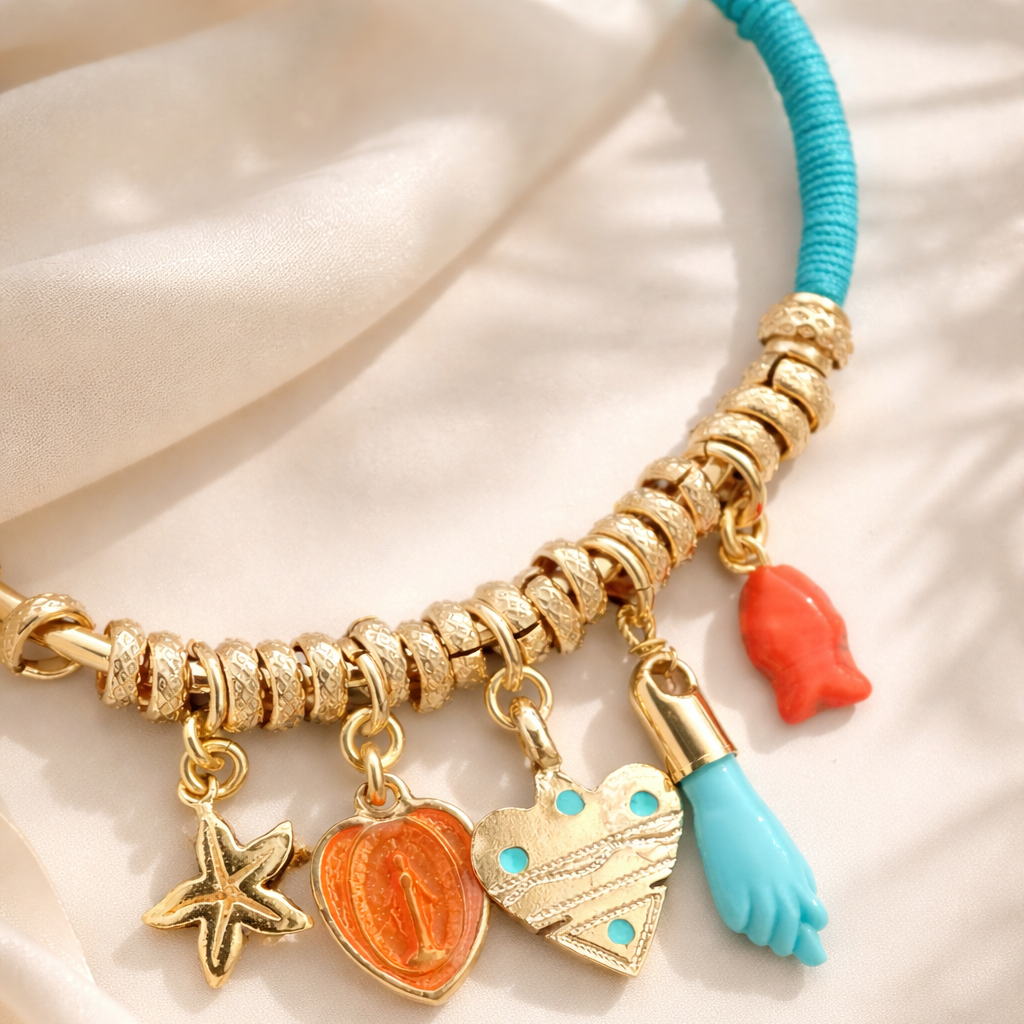 Bracelet with colorful charms on a beige fabric background