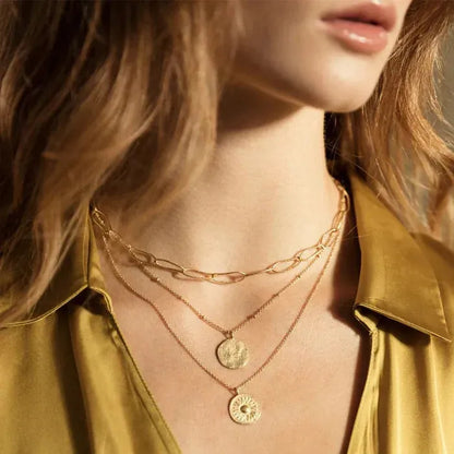Minimalist and delicate, this necklace feels like a precious ancient vestige. Its hammered full moon design will protect you day and night.