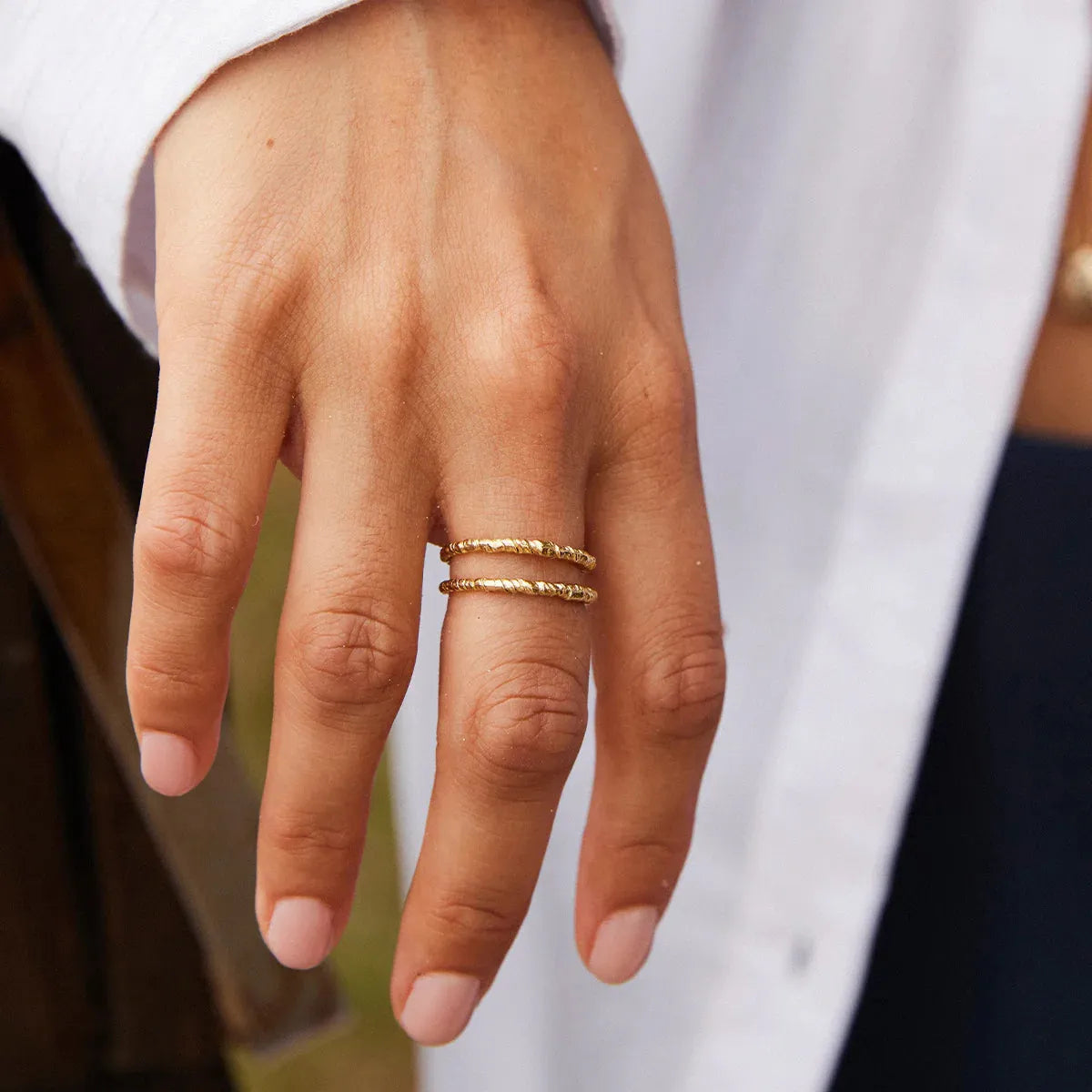 Agapee Zetita ring stacked close up on model hand