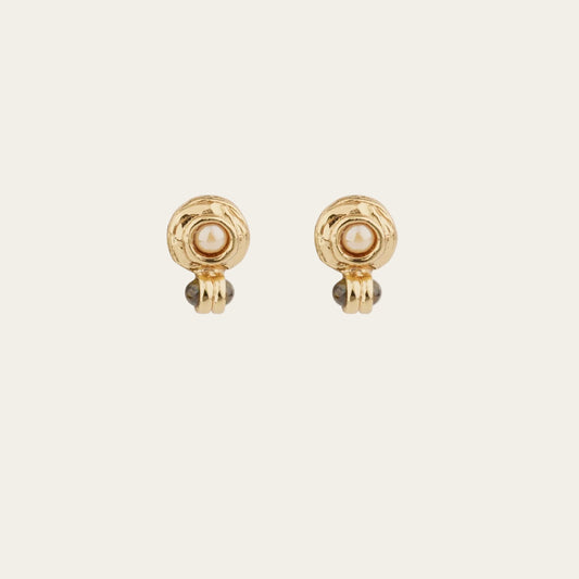 Two gold earrings with pearl on a white background