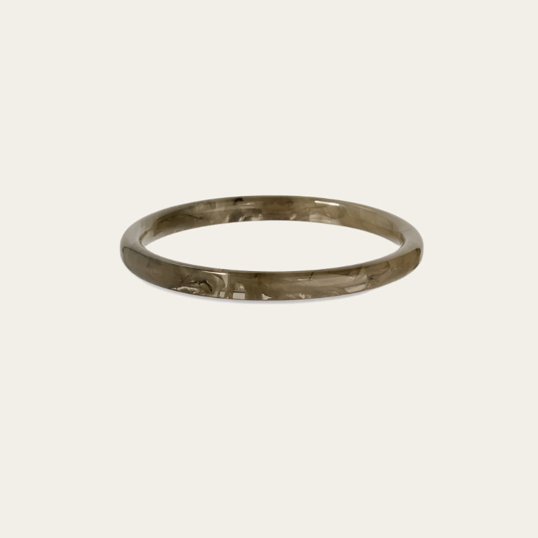 gas bijoux acetate bangle grey on flat lay neutral surface available at the artemis edit