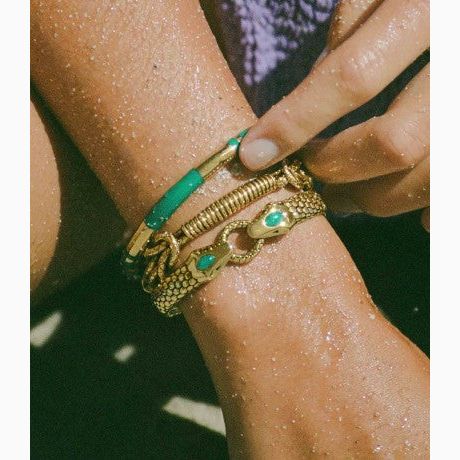 aurelie bidermann positano bangle close up image on models hand available at The Artemis Edit