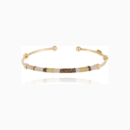 zanzibar gold plated bangle on white background available at The Artemis Edit