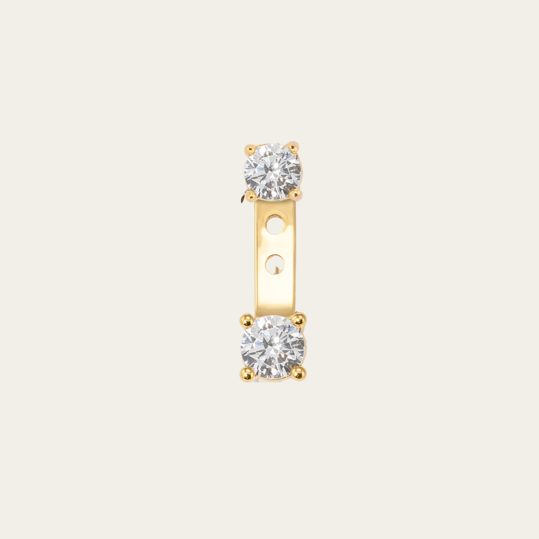 Gold earring with two diamond stones on a white background