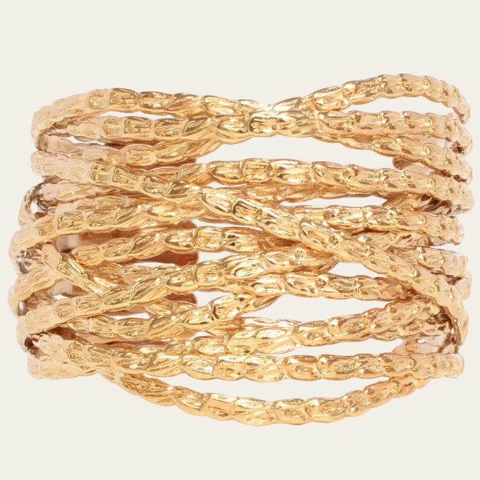 Gold bracelet with braided design on a white background