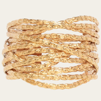 Gold bracelet with braided design on a white background