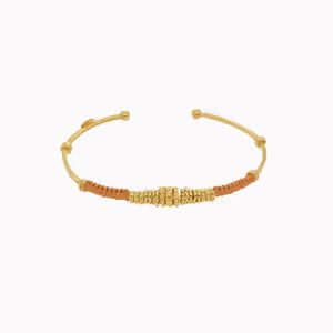 Gold bracelet on a white background