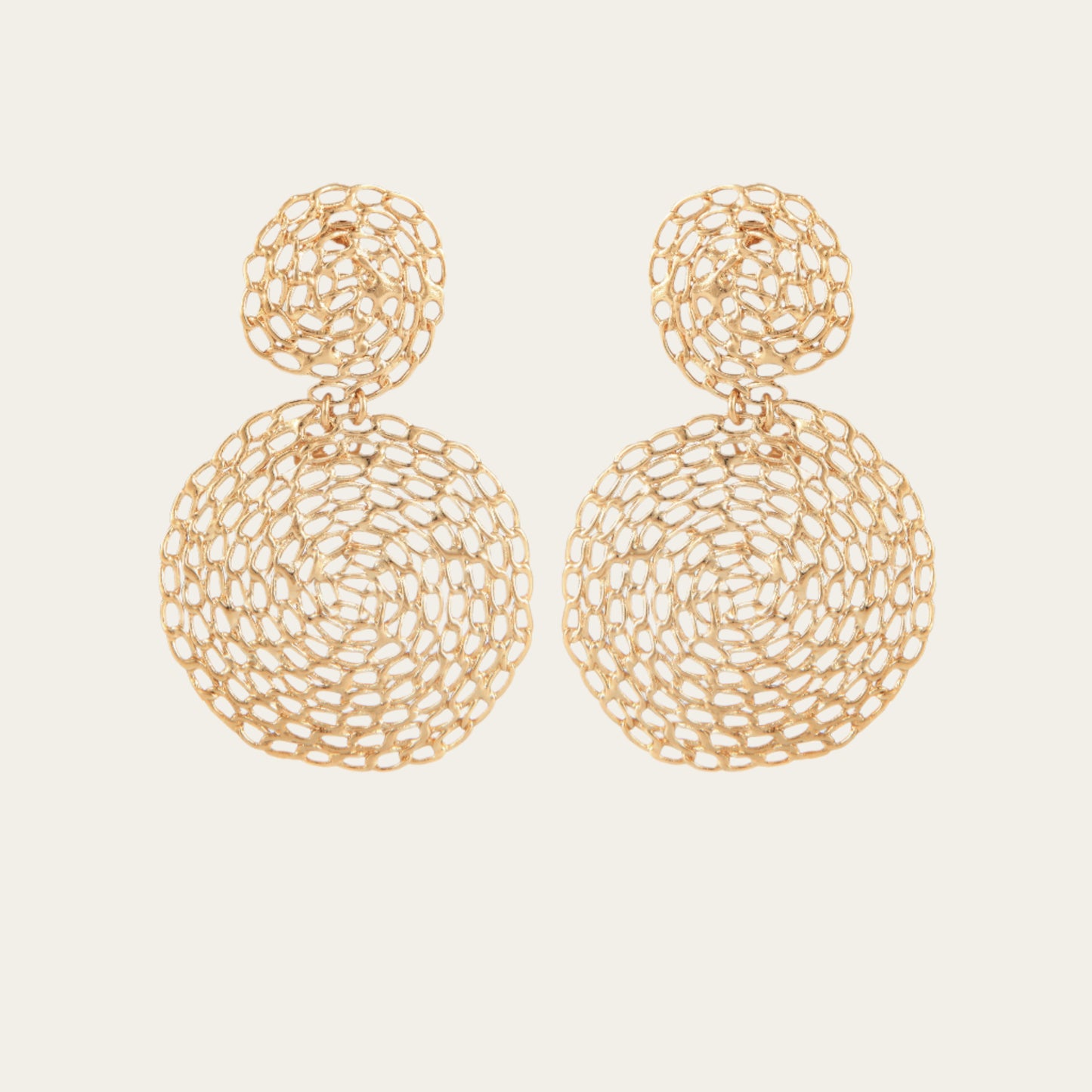 Gold plated round chain earrings on neutral background