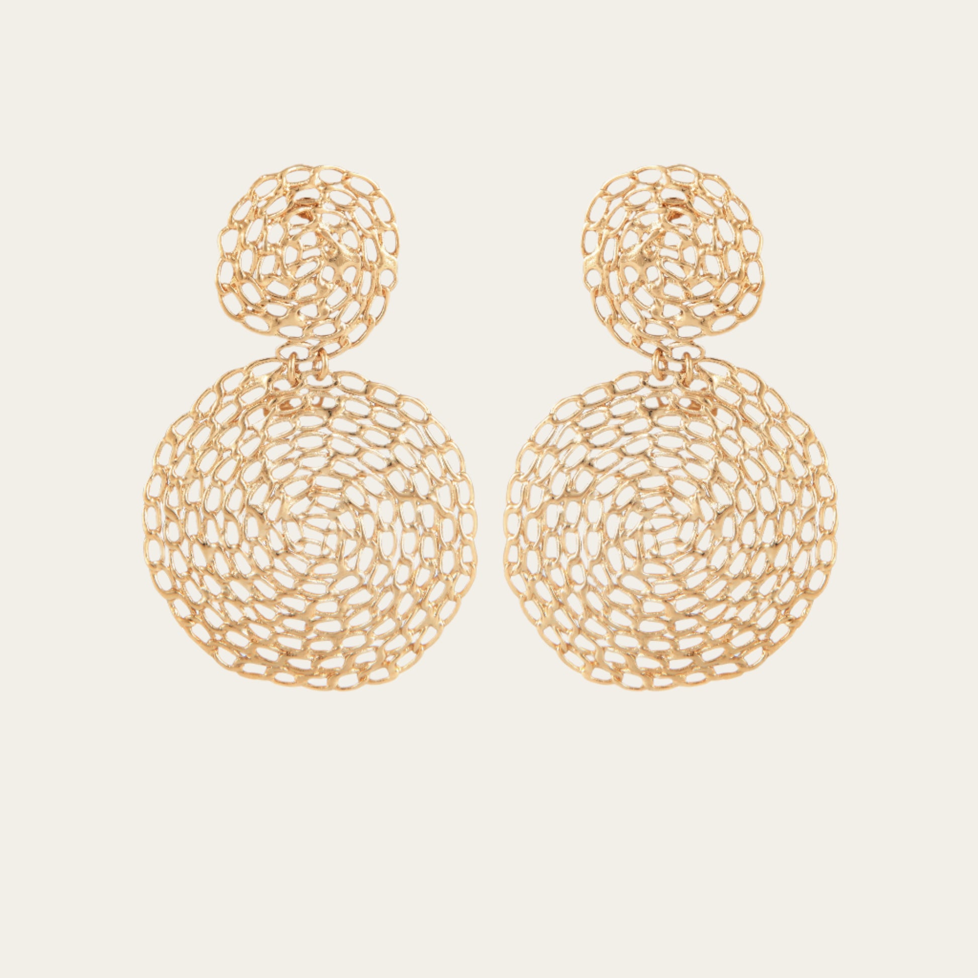 Gold plated round chain earrings on neutral background
