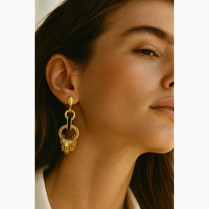 Woman wearing gold earrings with 'Welcome to The Artemis' text