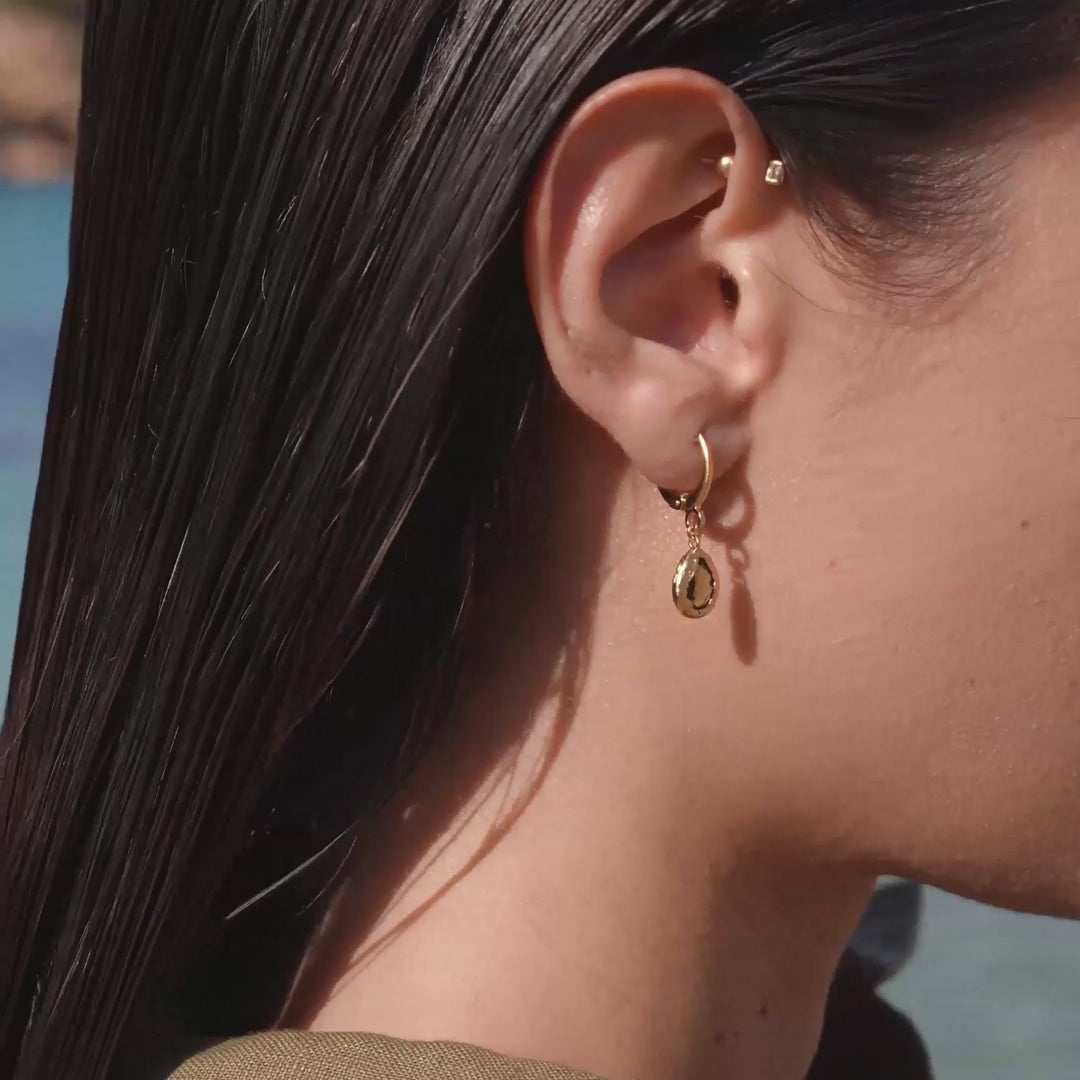 close up of Lysia earrings on woman